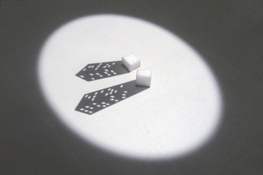 Vadim Fishkin, "Sugar twins", 2012, projector, two sugar cubes, table